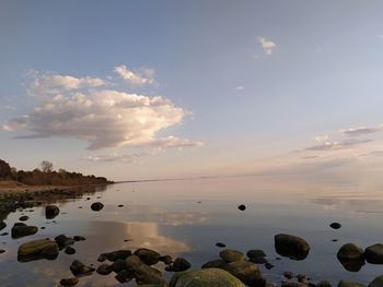 Scenic view of sea against sky at sunset