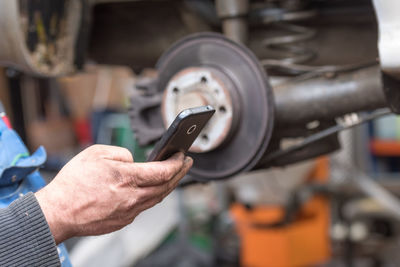 Close-up of man working at machine