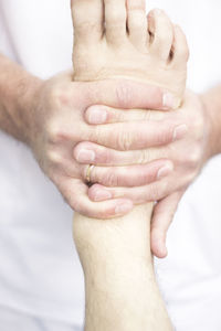 Midsection of person massaging foot