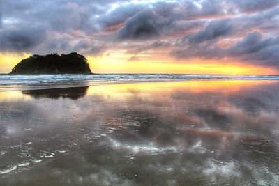 Scenic view of sea against sky at sunset