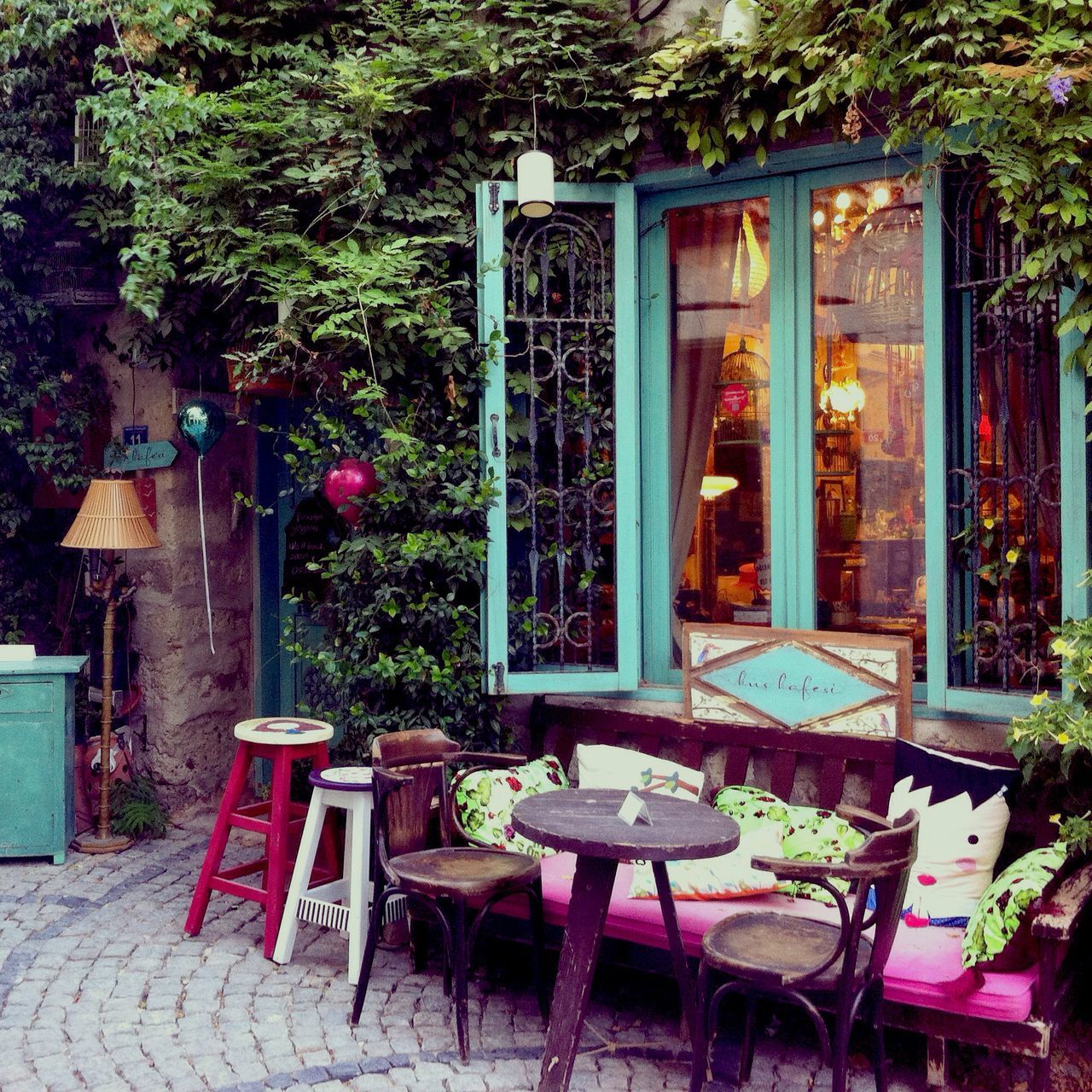 chair, built structure, architecture, building exterior, absence, potted plant, table, empty, house, tree, window, plant, growth, seat, front or back yard, day, no people, sunlight, wood - material, bench