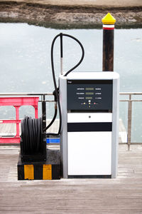 Information sign on table by lake