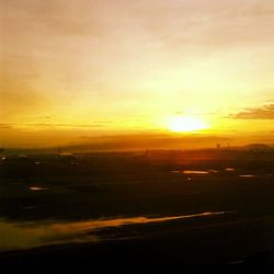 Scenic view of landscape against sky during sunset