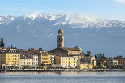 The beautiful lakeside of salò with the lake garda and the monte baldo in background