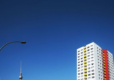 Low angle view of building against blue sky