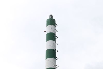 Low angle view of communications tower against sky