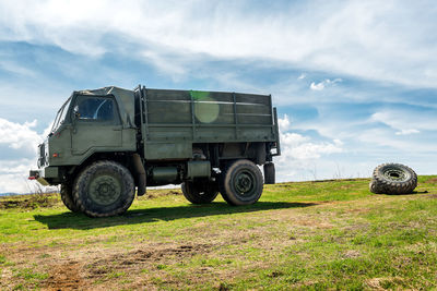 Tractor on field against sky
