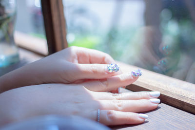 Close-up of woman hand on finger