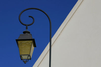 Low angle view of built structure against blue sky