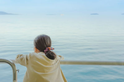 Rear view of woman looking at sea