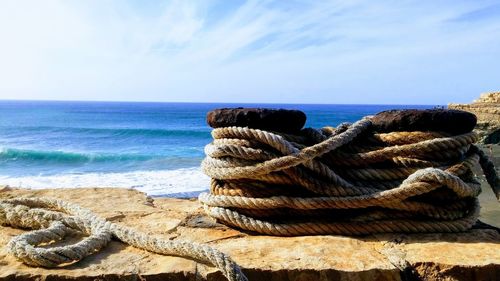 Close-up of rope tied on beach