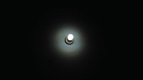 Close-up of illuminated light bulb