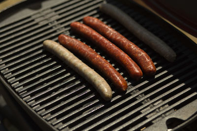 High angle view of meat on barbecue grill