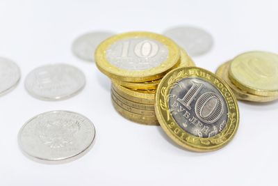 Close-up of coins on white background