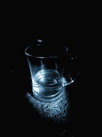 Close-up of coffee cup against black background