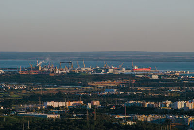 High angle view of buildings in city against clear sky