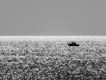 Boat sailing in sea