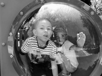 Portrait of boy with reflection on glass