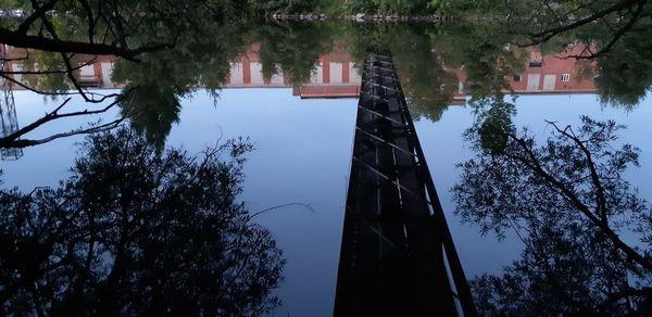 Low angle view of building and trees against sky