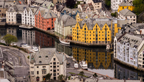 High angle view of river amidst buildings in city