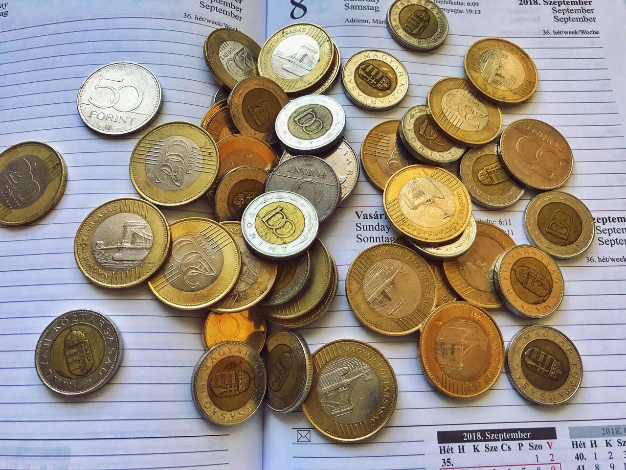 CLOSE-UP OF COINS WITH TEXT