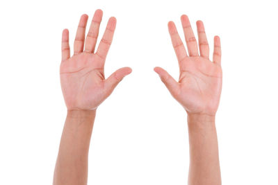 Close-up of human hand against white background