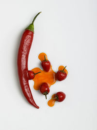 Close-up of tomatoes against white background