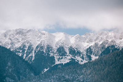 Scenic view of mountains against sky during winter