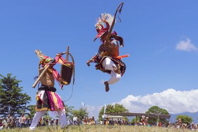 Group of people against the sky