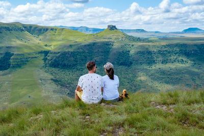 Rear view of couple looking at landscape