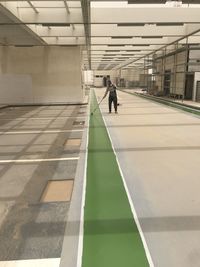 Man walking in corridor