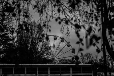 Low angle view of ferris wheel against sky