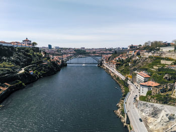 Bridge over river amidst houses in town