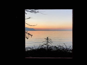 Scenic view of sea against sky at sunset