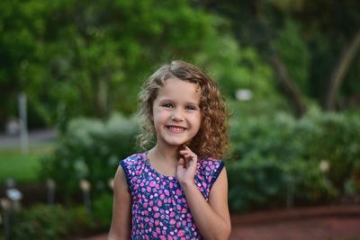 Portrait of smiling girl with wavy hair