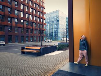 Rear view of man walking on street