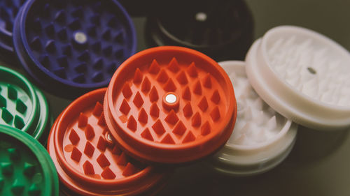 Close-up high angle view of grinders on table