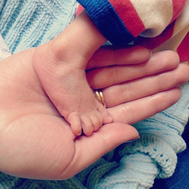 person, part of, bonding, love, togetherness, human finger, unknown gender, family with one child, holding hands, lifestyles, baby, close-up, family, holding