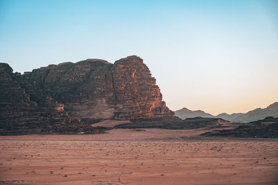 Scenic view of desert against clear sky