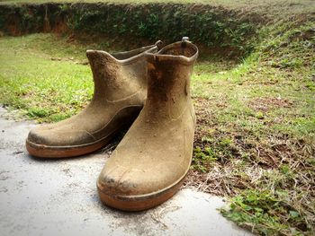 Close-up of shoes on field