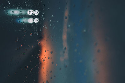 Full frame shot of wet glass window in rainy season