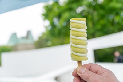 Close-up of hand holding ice cream cone