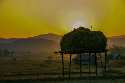 Scenic view of landscape at sunset