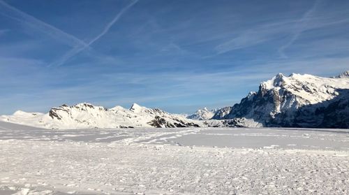 Scenic view of snowcapped mountains against sky