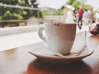 Close-up of coffee cup on table