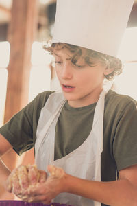 Portrait of boy baking