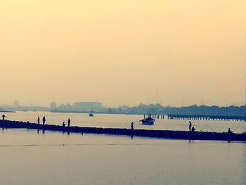 Scenic view of sea against clear sky during sunset