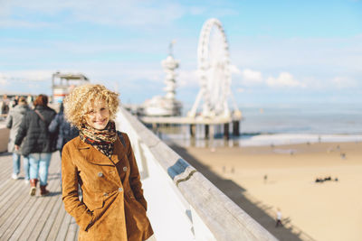 Front view of woman against blue sky