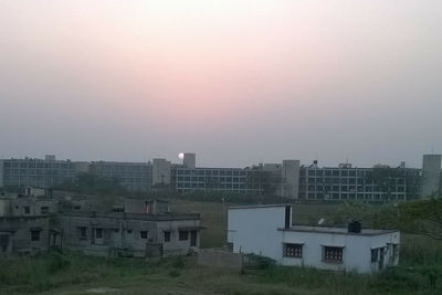 High angle view of buildings against sky during sunset