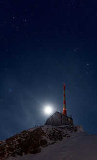 Low angle view of building against sky at night